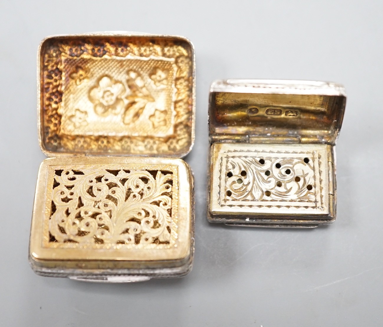 A George IV silver vinaigrette, embossed with flowers and flower heads, Ledsam & Vale?, Birmingham, 1820, 25mm and one other smaller Victorian silver vinaigrette, by Edward Smith.